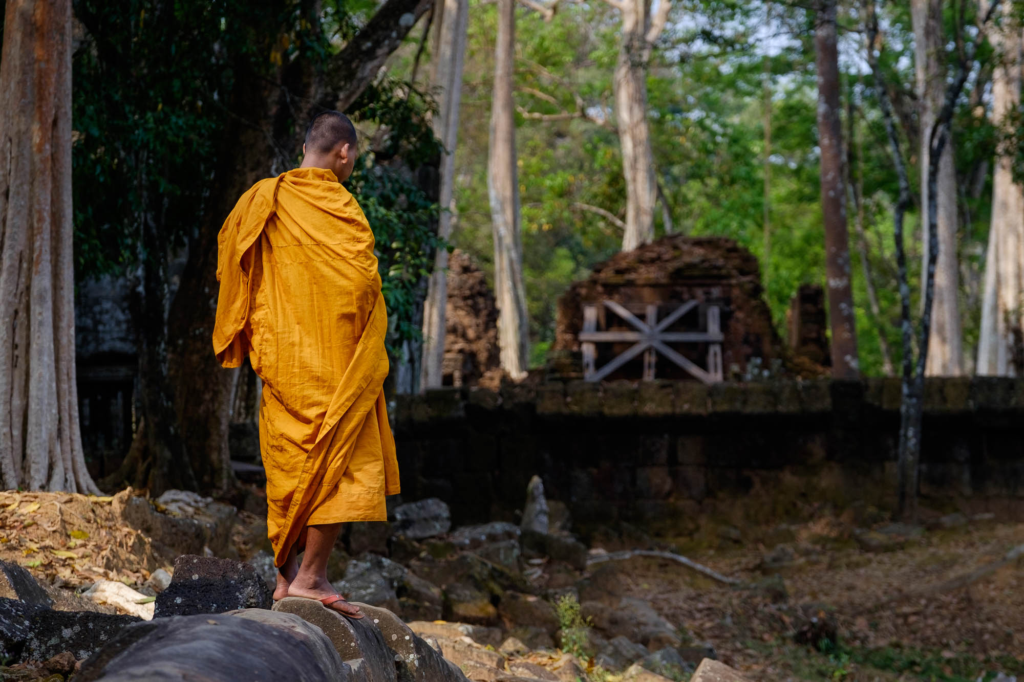 Monk in front of an old temple - Cambodia